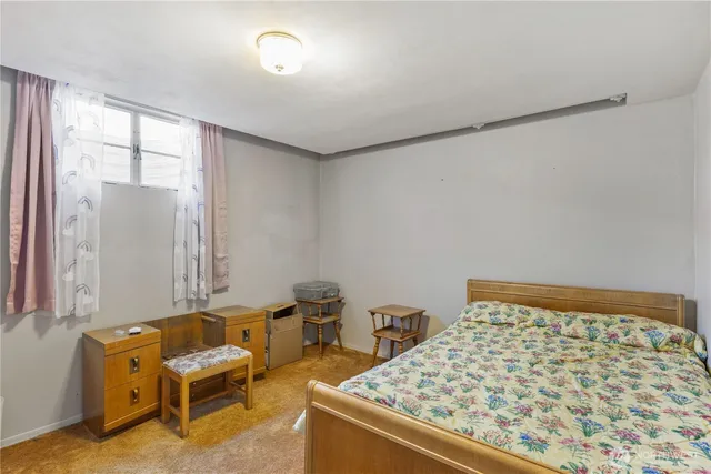 a bedroom with a bed and a closet