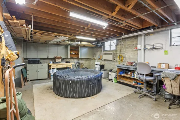 a room with fridge and a book shelf