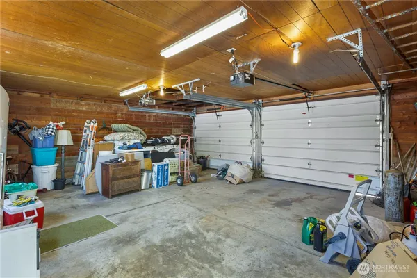 a view of a backyard with plants and a patio