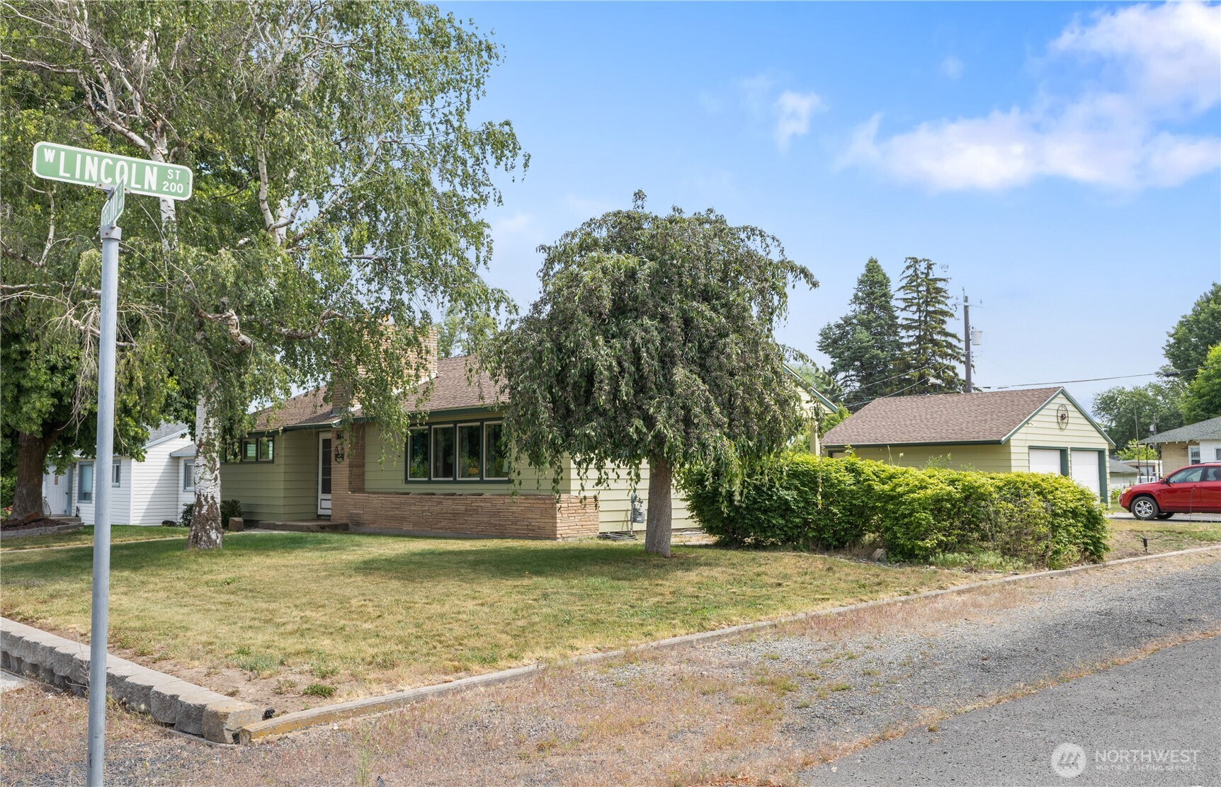 308 North 2nd Street Harrington, WA 99134 - Photo 33 of 37 a view of a house with backyard and trees