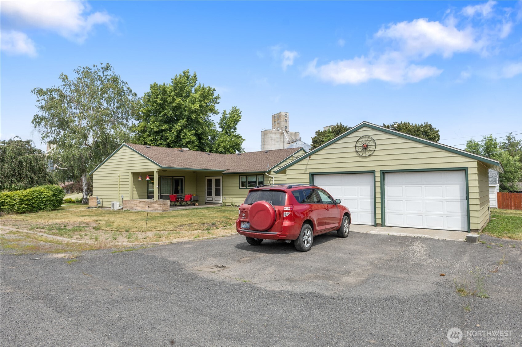 308 North 2nd Street Harrington, WA 99134 - Photo 37 of 37 a front view of a house with a garden and parking space