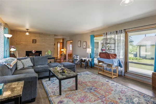 a living room with furniture and a flat screen tv