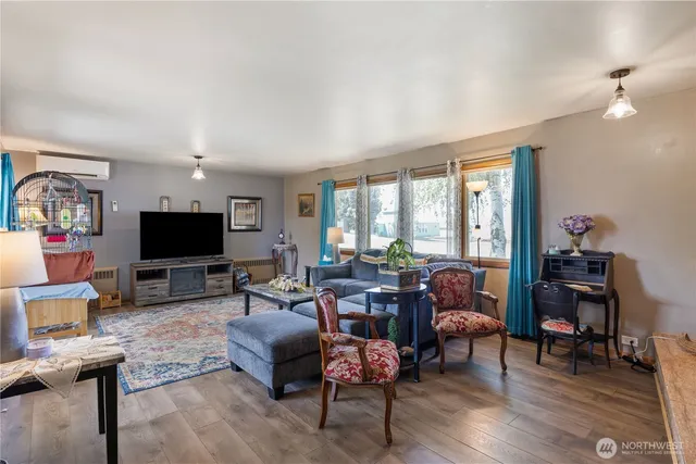 a view of a dining room with furniture and window