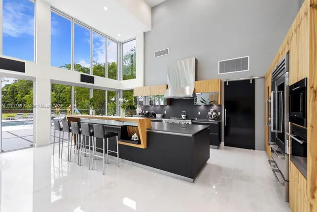 a view of a chair and tables in the balcony