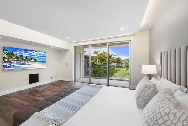 a view of a chair and tables in the balcony