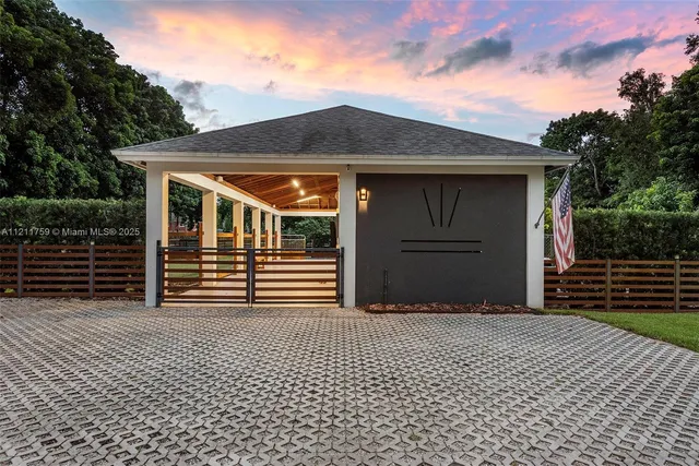 a view of a house with swimming pool and sitting area