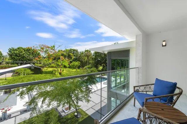 a aerial view of a house with a big yard