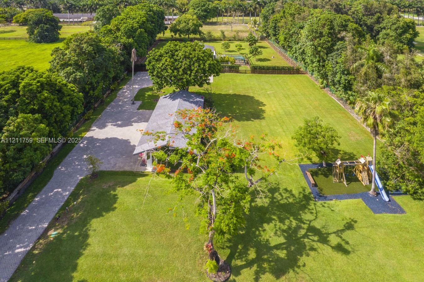 14305 Stirling Road Southwest Ranches, FL 33330 - Photo 54 of 66 a view of a swimming pool with a patio