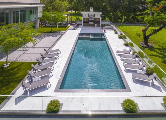 a kitchen with stainless steel appliances granite countertop a stove and a refrigerator