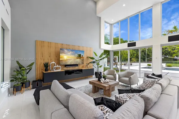 a kitchen with stainless steel appliances a sink and a large window