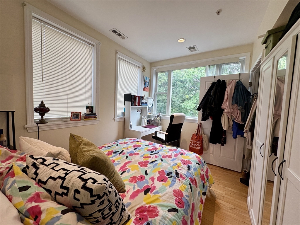1801 Beacon Street, Unit 4 Brookline, MA 02445 - Photo 9 of 9 a bedroom with bed and glass door