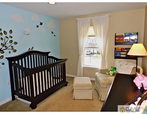 10 Carnation Road Monroe Township, NJ 08831 - Photo 17 of 25 a bedroom with furniture and a window