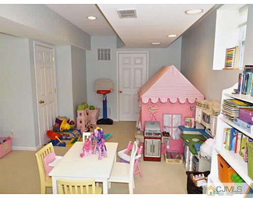 10 Carnation Road Monroe Township, NJ 08831 - Photo 23 of 25 a very nice looking room with many windows