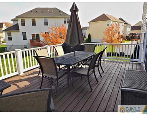 10 Carnation Road Monroe Township, NJ 08831 - Photo 24 of 25 a view of a chairs and table on the terrace