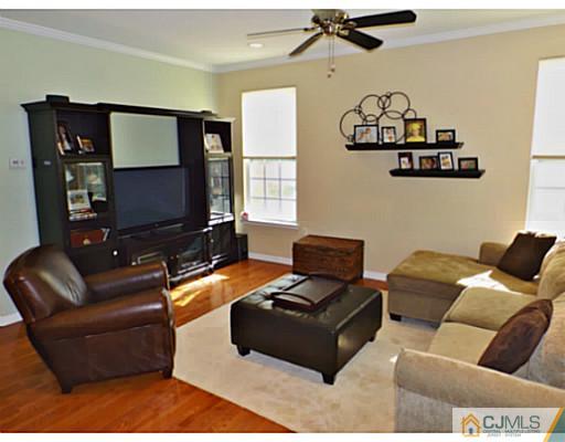 10 Carnation Road Monroe Township, NJ 08831 - Photo 4 of 25 a living room with furniture and a flat screen tv