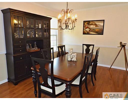 10 Carnation Road Monroe Township, NJ 08831 - Photo 5 of 25 a view of a dining room with furniture and chandelier