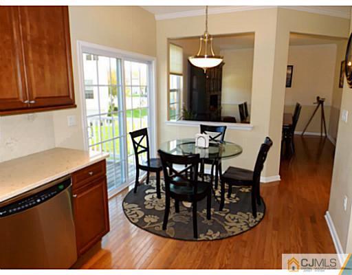 10 Carnation Road Monroe Township, NJ 08831 - Photo 9 of 25 a view of a dining room with furniture and wooden floor
