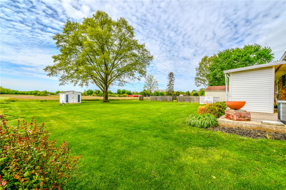 10833 Kendig Road Medway, OH 45341 - Photo 42 of 46 This spacious yard offers ample outdoor living space and includes a practical storage shed.