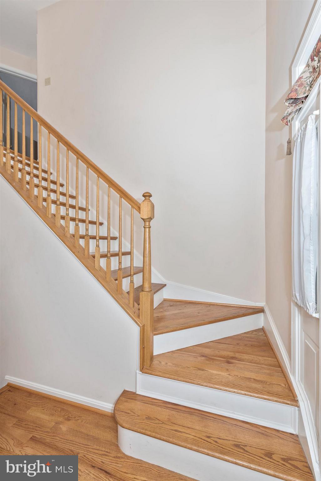 2426 Stoney Creek Road Frederick, MD 21701 - Photo 5 of 39 Hardwood curved staircase to upper level