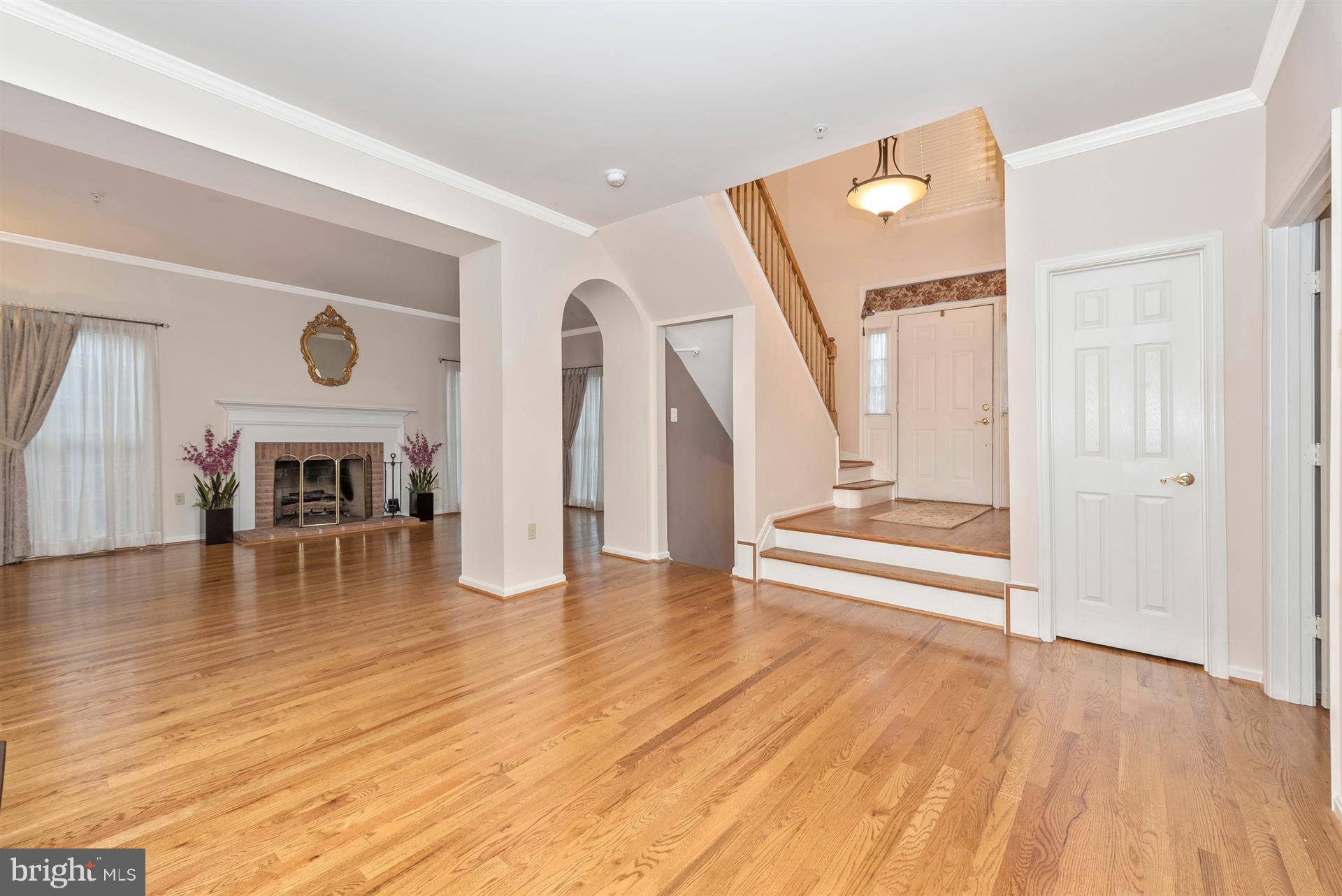 2426 Stoney Creek Road Frederick, MD 21701 - Photo 7 of 39 Dining room view of living room and foyer.