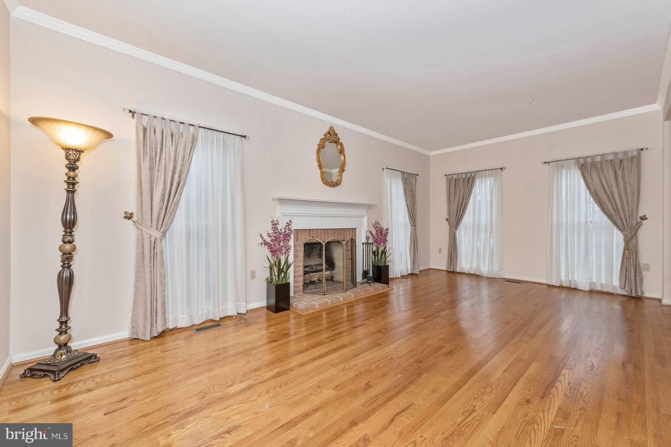 2426 Stoney Creek Road Frederick, MD 21701 - Photo 8 of 39 Hardwood floors and long windows grace living room