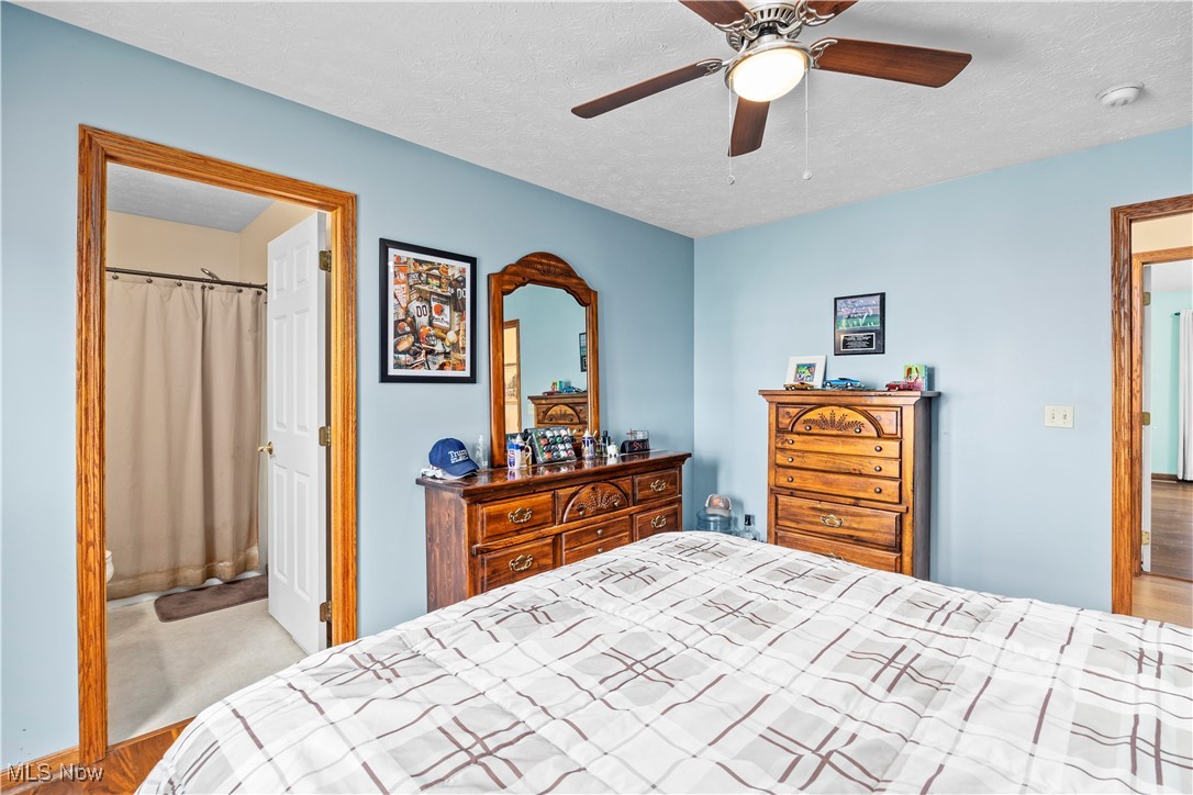 47147 Merriam Road Wellington, OH 44090 - Photo 34 of 49 Bedroom with a textured ceiling, wood finished floors, and ceiling fan