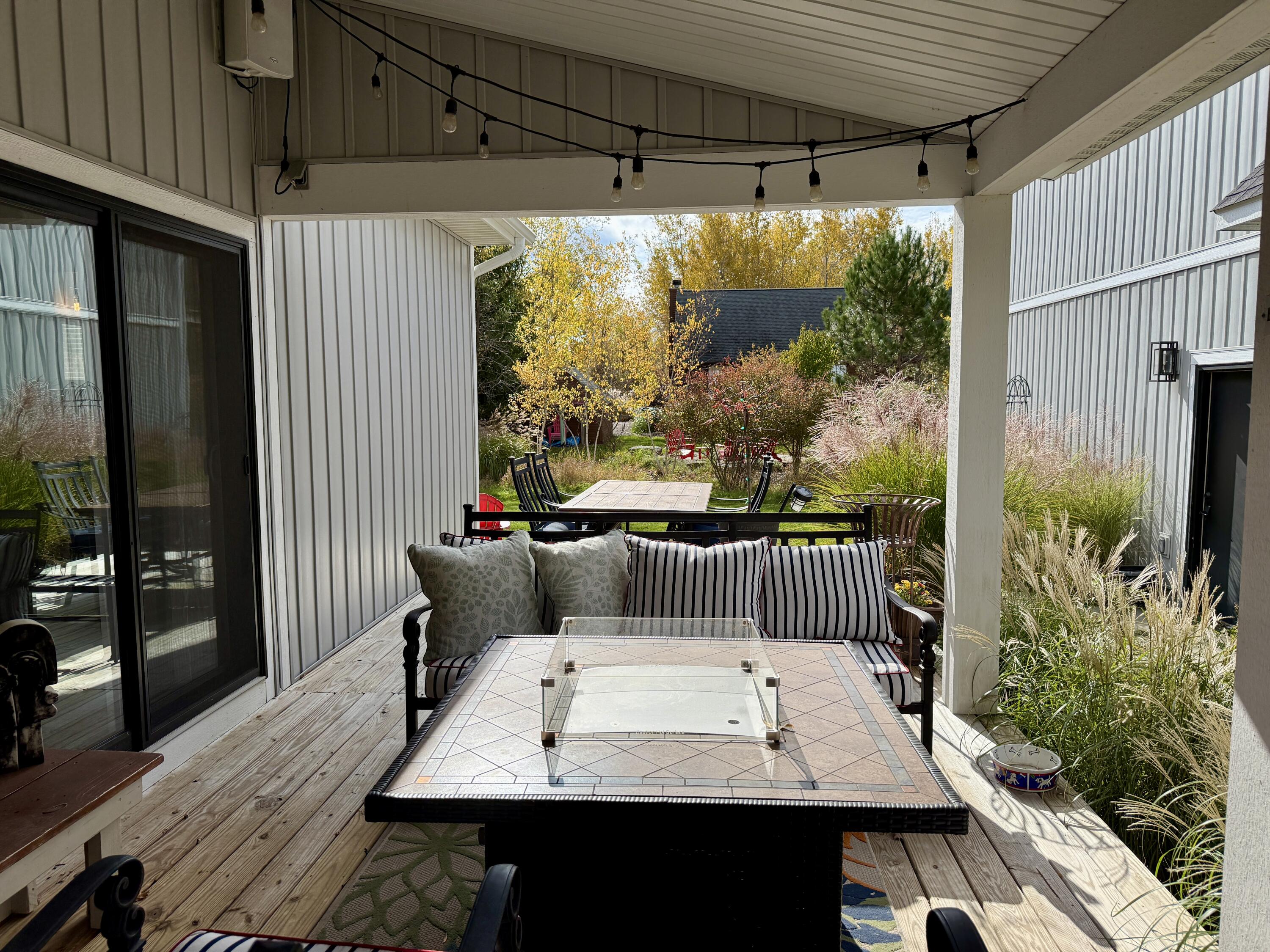6910 3rd Street Douglas, MI 49406 - Photo 38 of 64 Covered porch with attached dining deck