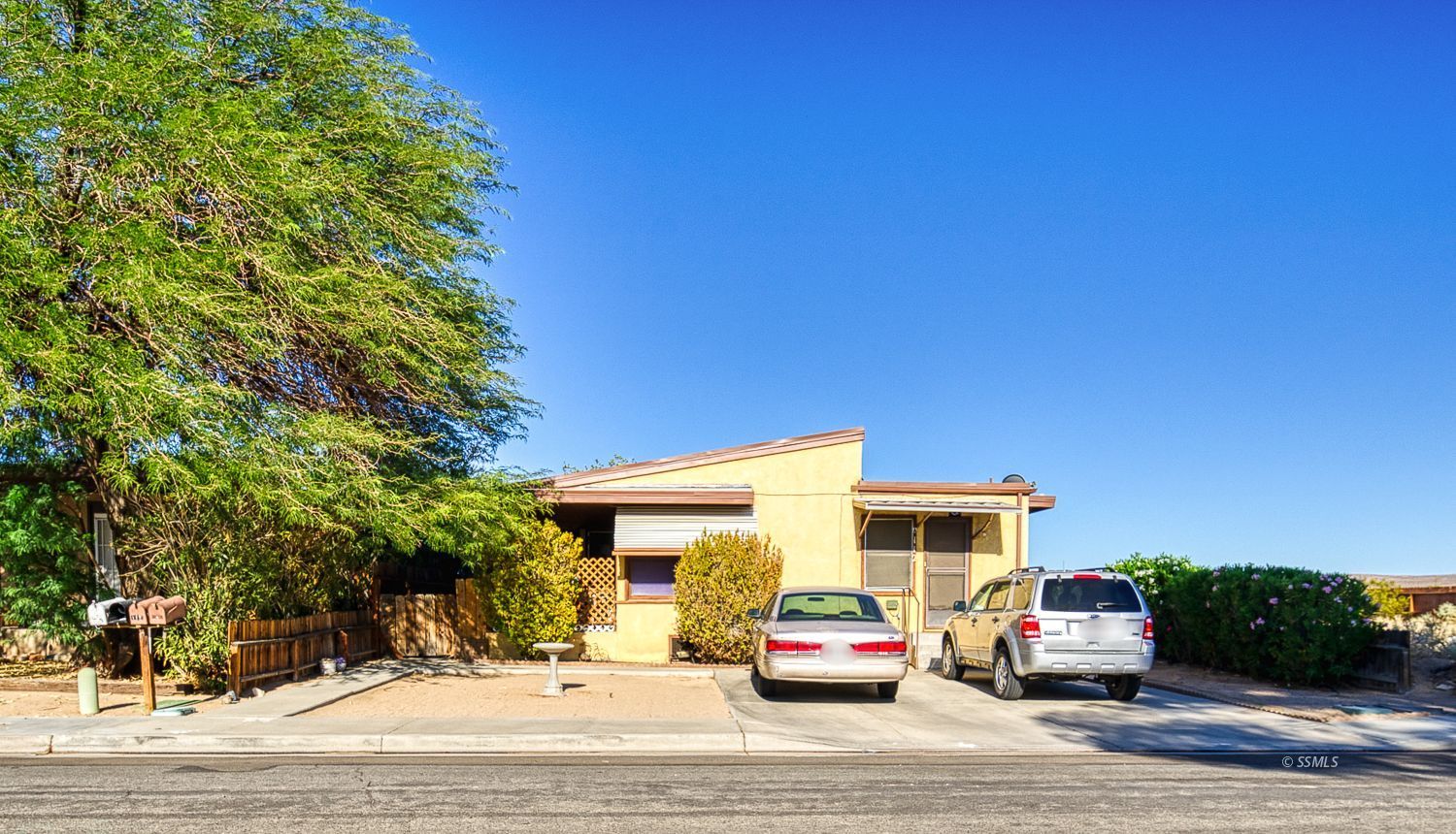 112 South Valley Street Ridgecrest, CA 93555 - Photo 1 of 19 a car parked on the side of the road