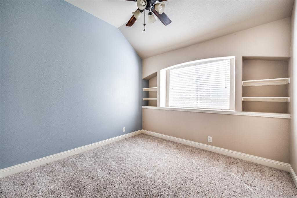 817 Lighthouse Lane Savannah, TX 76227 - Photo 17 of 20 an empty room with a window and a ceiling fan