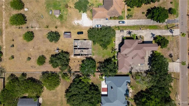 an aerial view of a houses with outdoor space