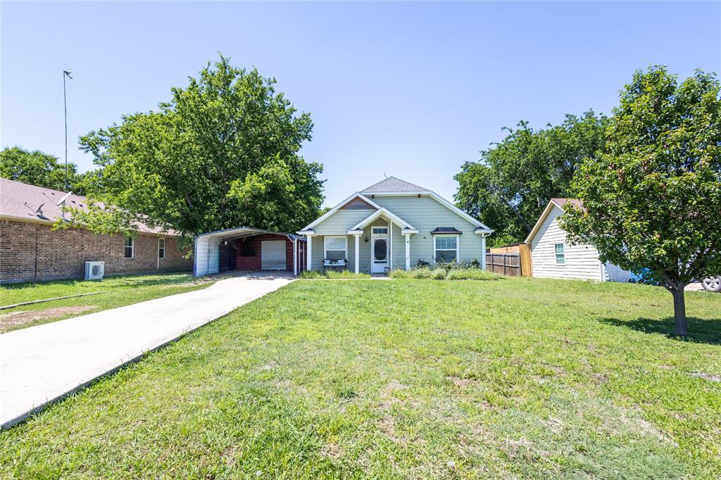 512 Milton Road Josephine, TX 75173 - Photo 2 of 31 a front view of a house with garden