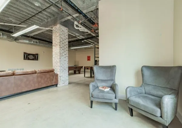 a living room with furniture and a table