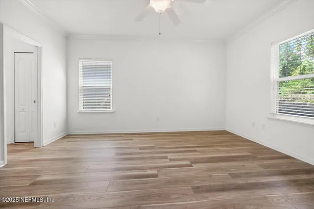 an aerial view of multiple houses with yard