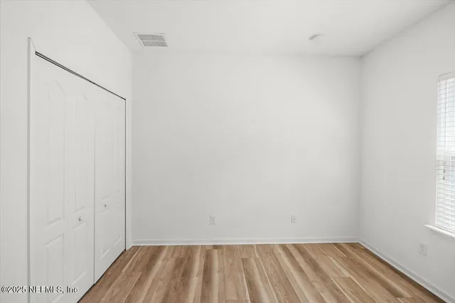 an aerial view of a house with outdoor space and a lake view