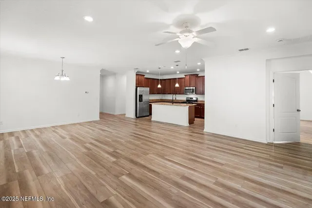 a bedroom with a large bed and a flat screen tv