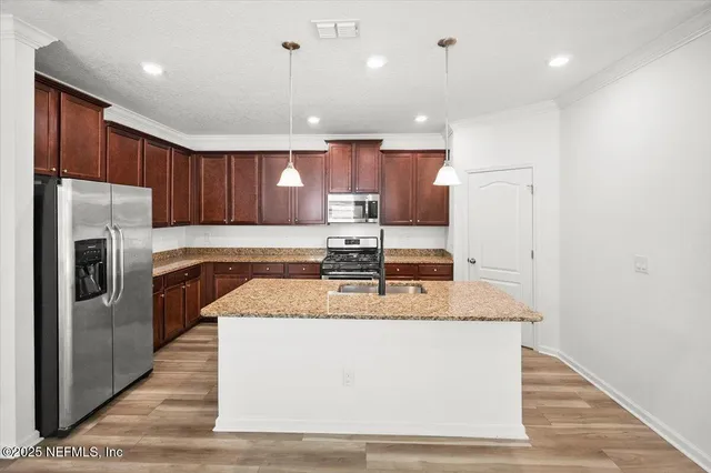 a bathroom with a double vanity sink and mirror