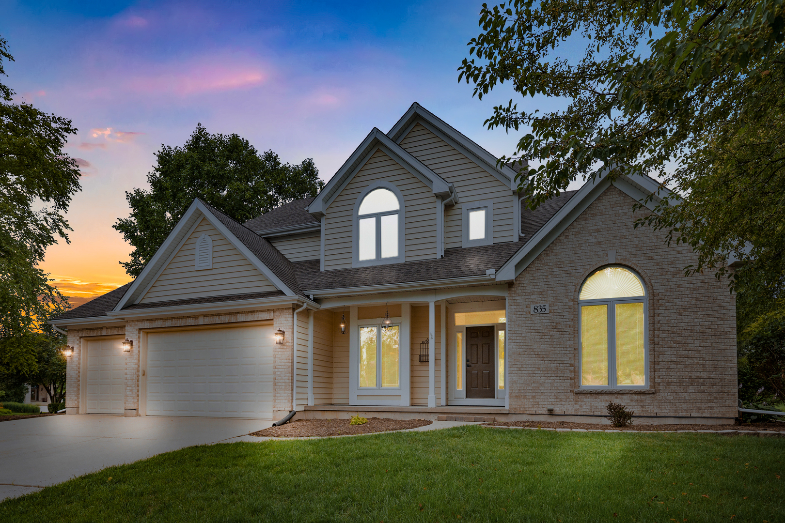 front view of a house with a yard