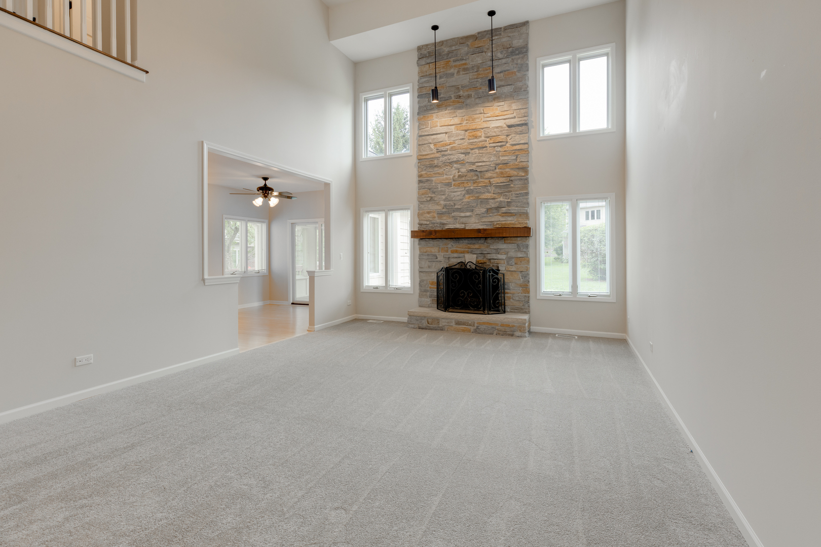 835 Longview Court Sugar Grove, IL 60554 - Photo 11 of 32 a view of an empty room with a fireplace and a window