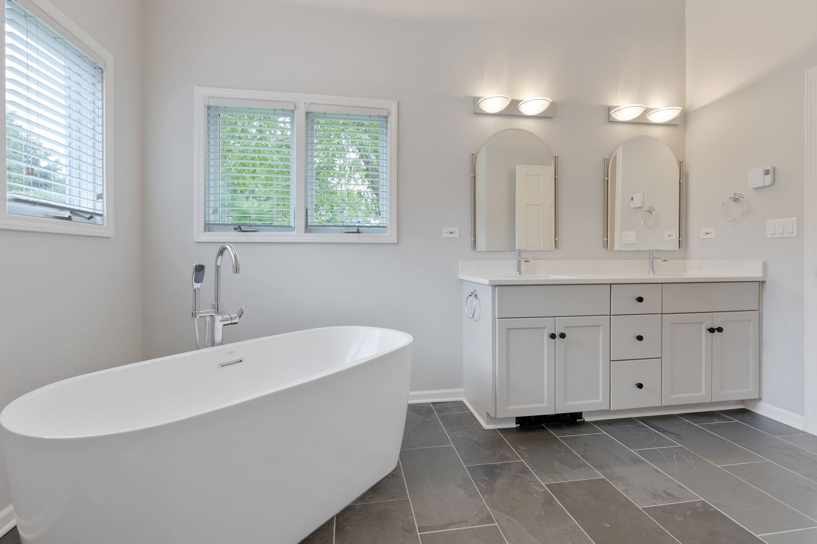 835 Longview Court Sugar Grove, IL 60554 - Photo 13 of 32 a bathroom with a bathtub a double vanity sink and a window