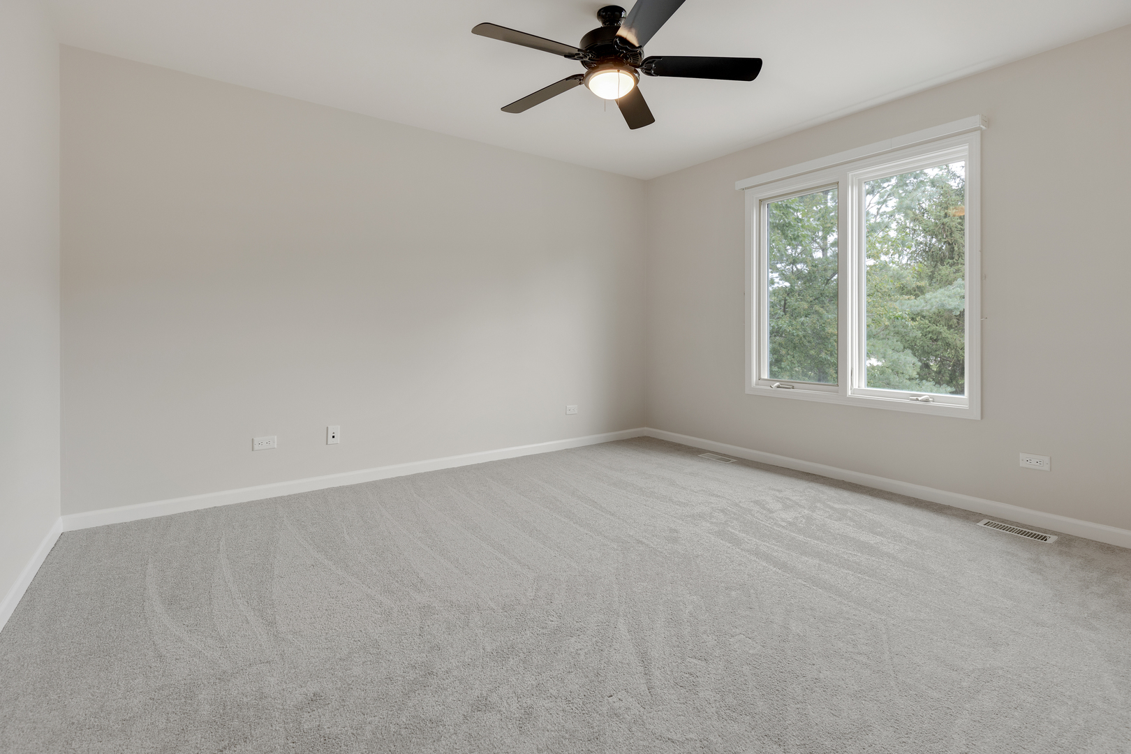 835 Longview Court Sugar Grove, IL 60554 - Photo 24 of 32 an empty room with a window and a fan