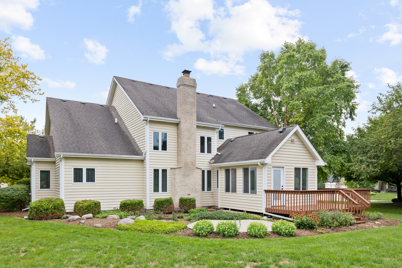 835 Longview Court Sugar Grove, IL 60554 - Photo 30 of 32 a front view of a house with a garden and plants