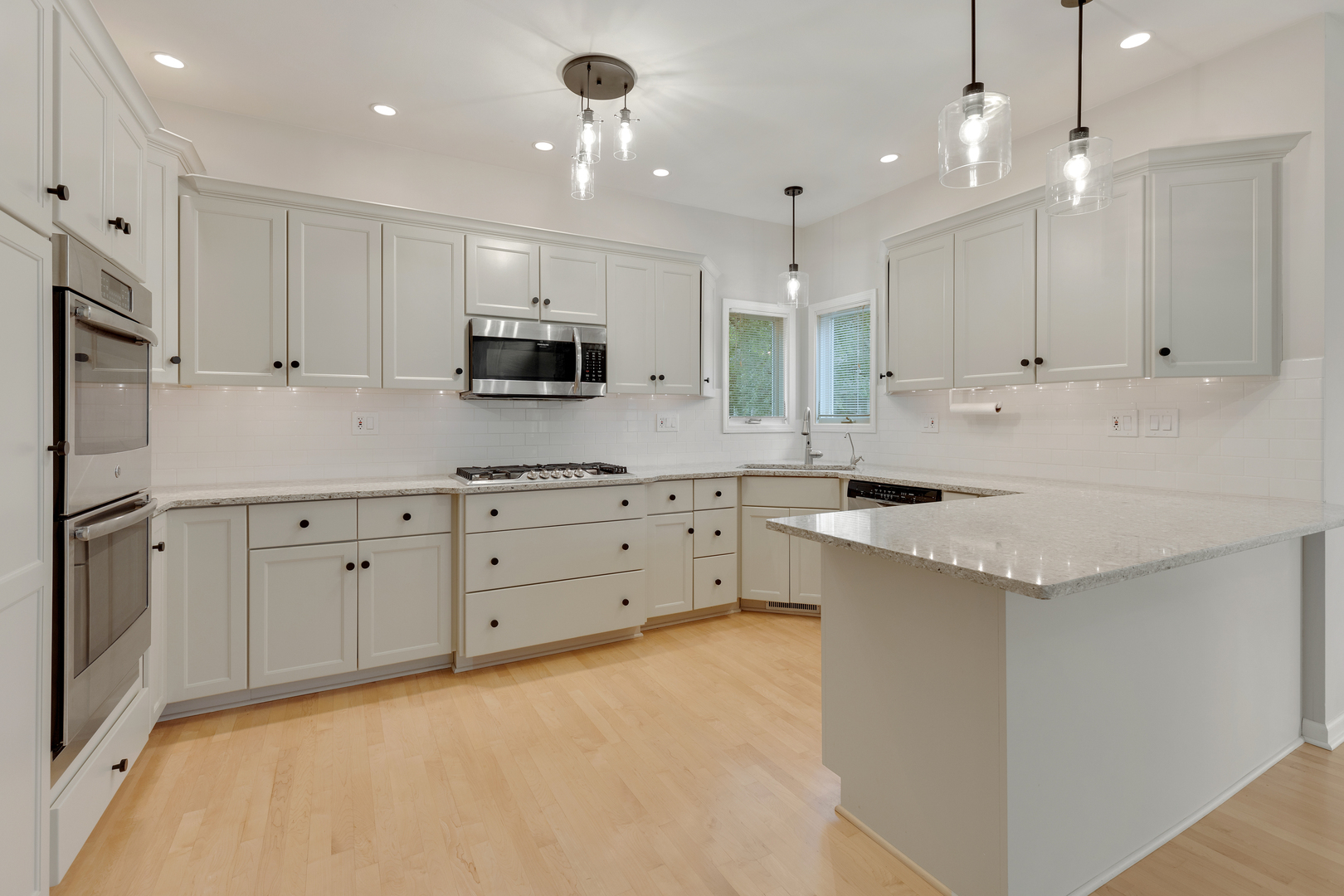 835 Longview Court Sugar Grove, IL 60554 - Photo 3 of 32 a kitchen with white cabinets and stainless steel appliances