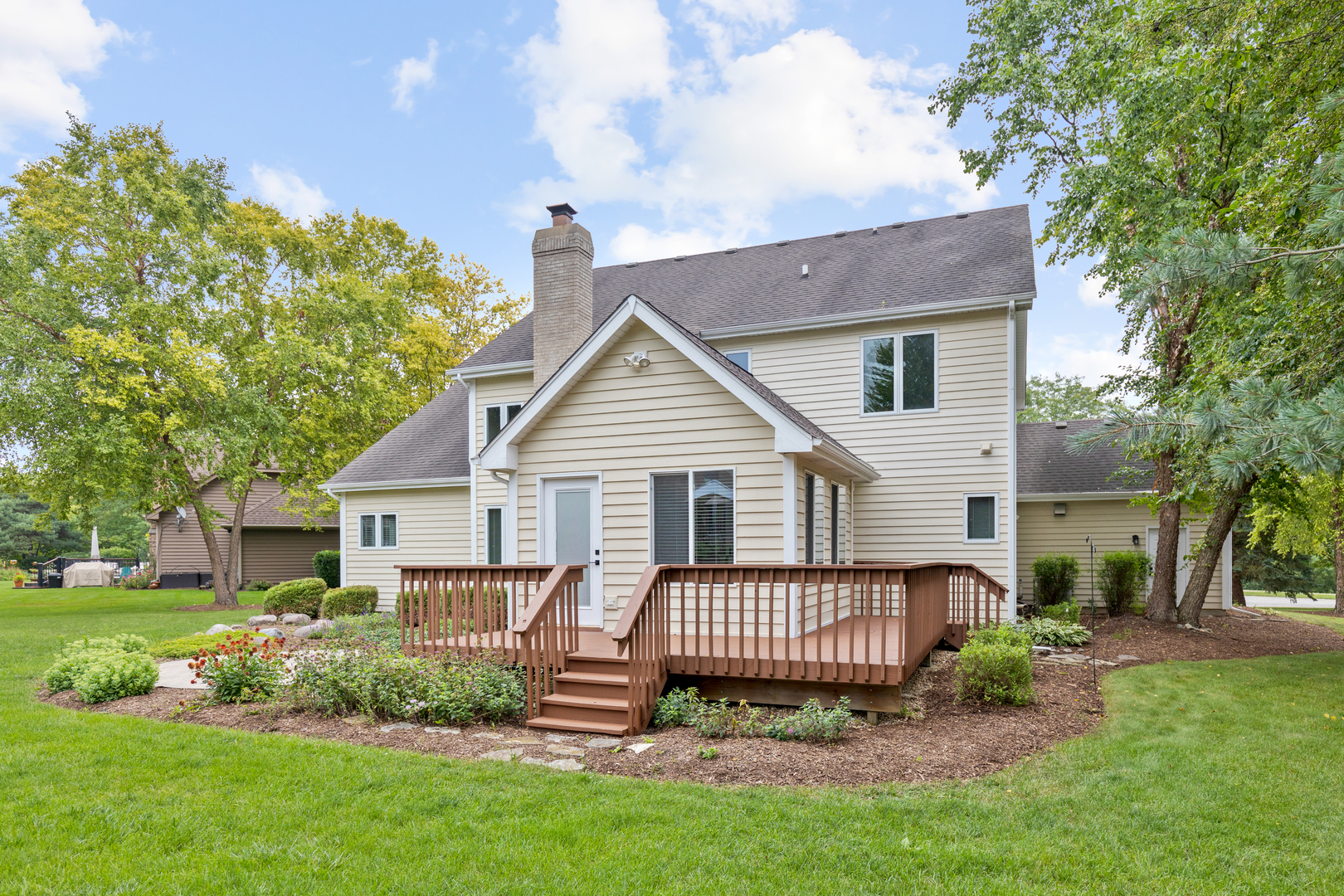 835 Longview Court Sugar Grove, IL 60554 - Photo 7 of 32 a view of a house with a yard and lawn chairs with a fire pit