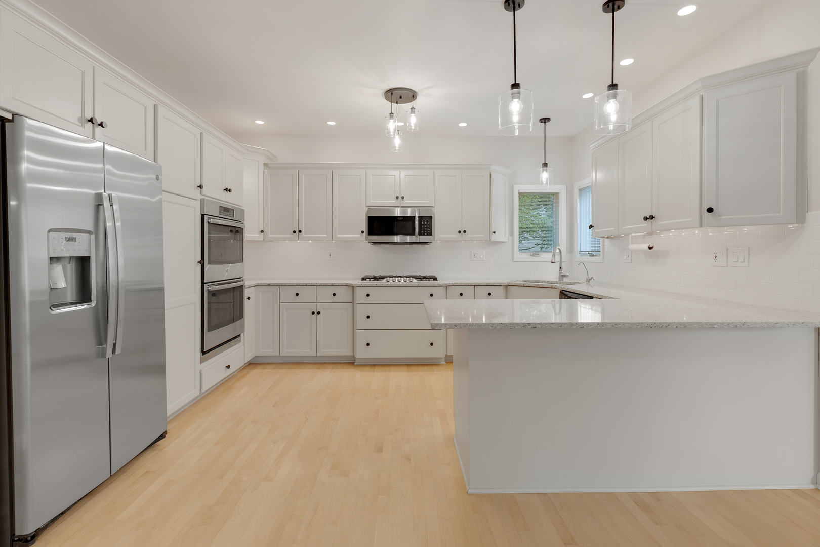 835 Longview Court Sugar Grove, IL 60554 - Photo 9 of 32 a large kitchen with cabinets and stainless steel appliances