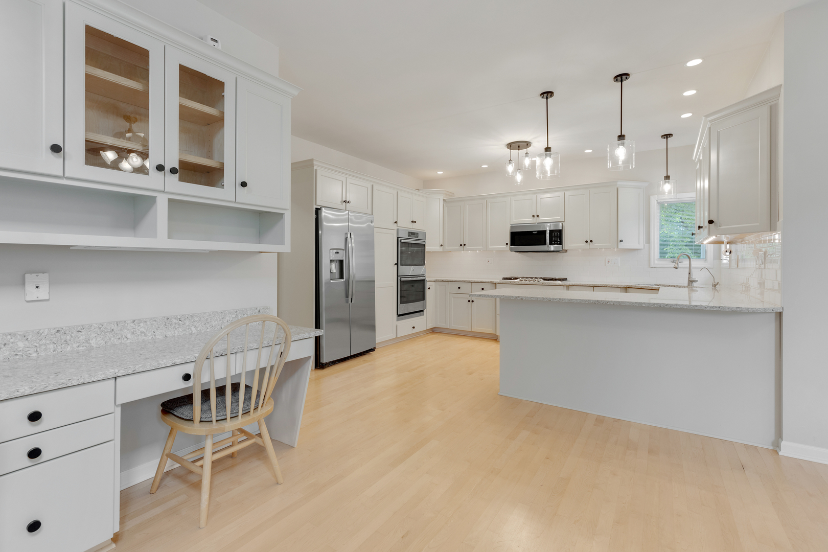 835 Longview Court Sugar Grove, IL 60554 - Photo 10 of 32 a large kitchen with stainless steel appliances kitchen island granite countertop a table chairs in it and wooden floors