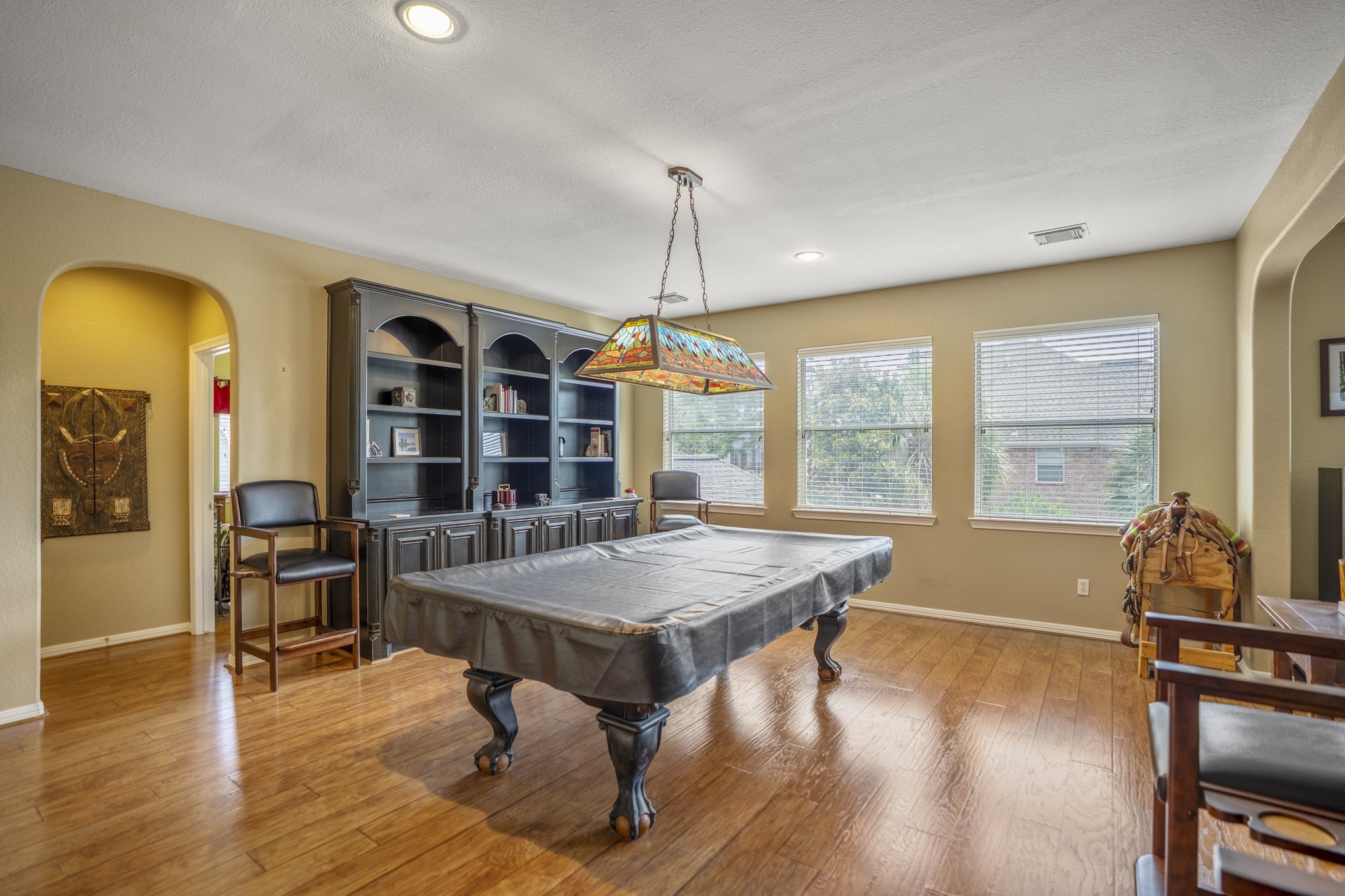 1438 Hatchmere Place Spring, TX 77379 - Photo 23 of 50 As you come up the stairs you will find this large game room offering a billards table, three large windows, plenty of space to have several gaming areas or relaxing space for your familiies fun.