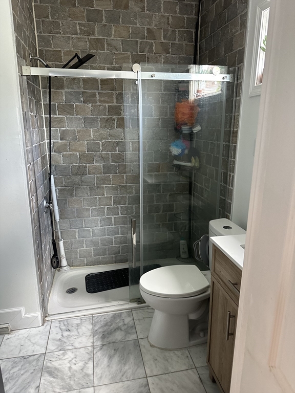 58 Walnut Street Everett, MA 02149 - Photo 11 of 15 a bathroom with a toilet and a shower