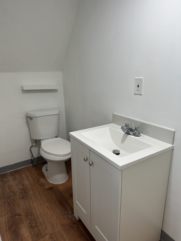 58 Walnut Street Everett, MA 02149 - Photo 3 of 15 a bathroom with a toilet sink and mirror