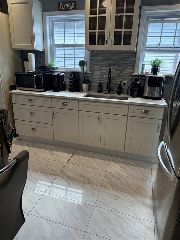 58 Walnut Street Everett, MA 02149 - Photo 7 of 15 a kitchen with a sink and cabinets