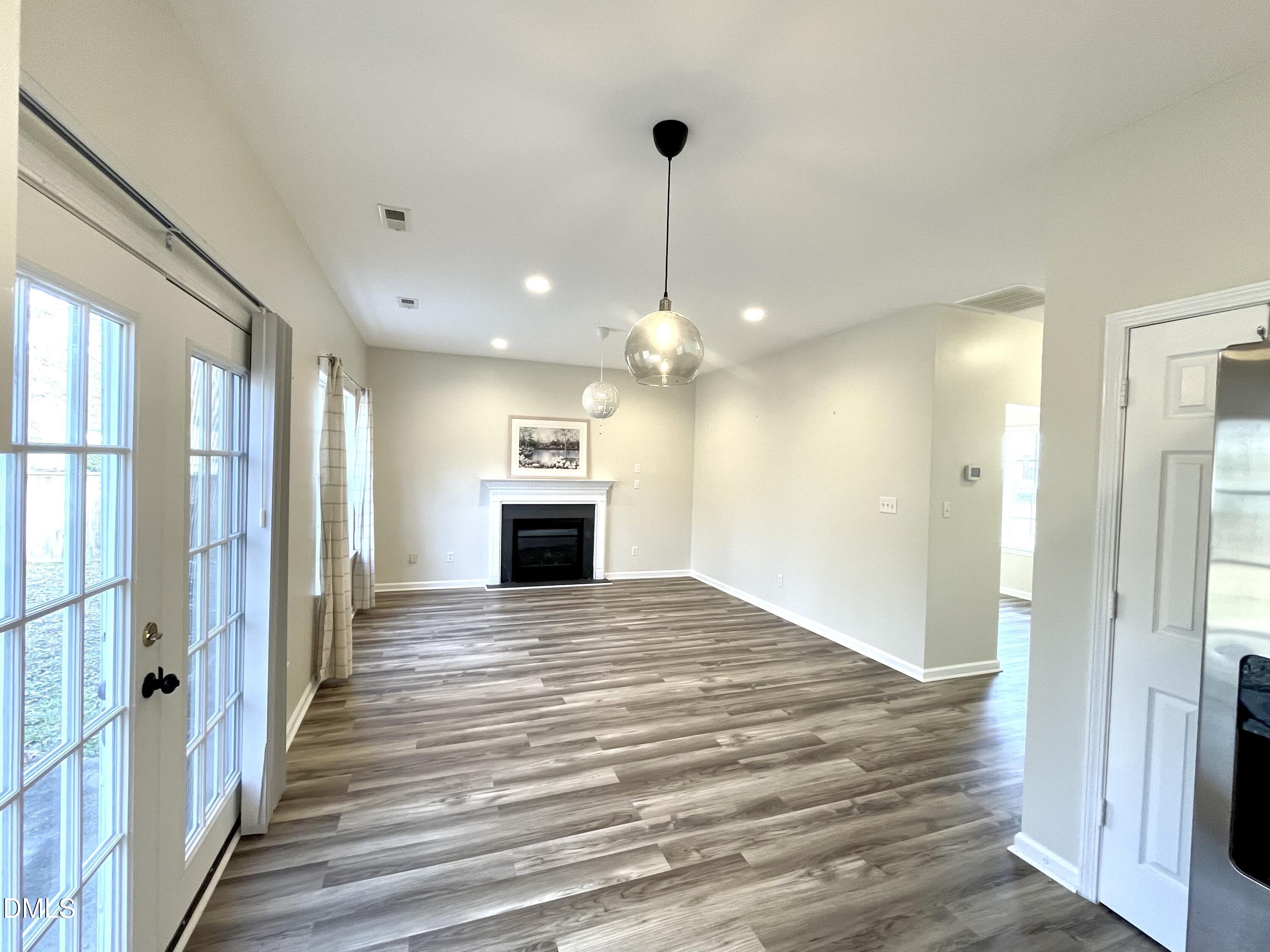 5506 Grand Mesa Drive Durham, NC 27713 - Photo 12 of 28 a view of a kitchen with a sink and a ceiling fan